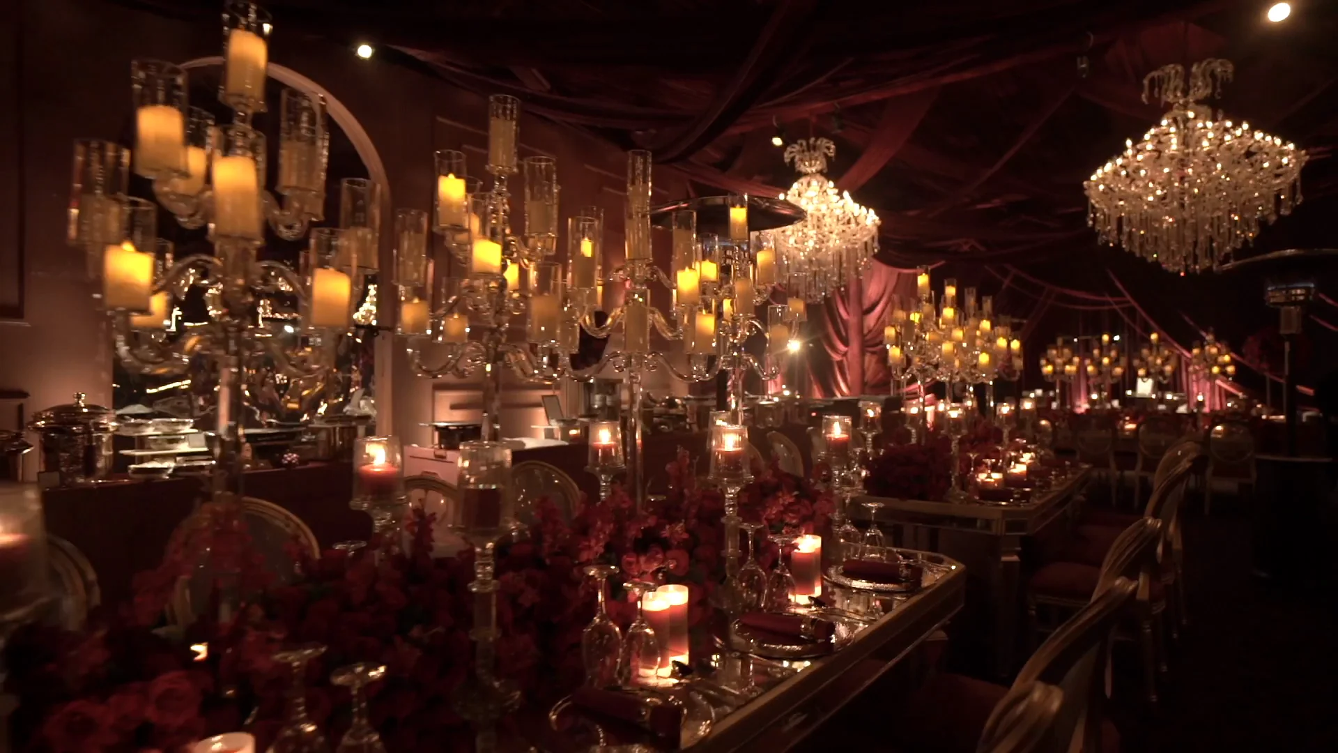 A candlelit heritage banquet hall with crystal chandeliers and silver service